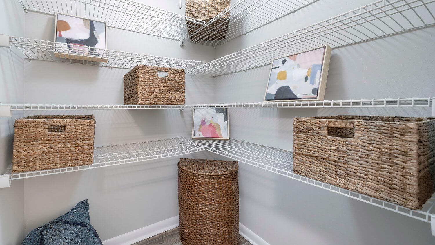 walk-in closet with white wired shelving