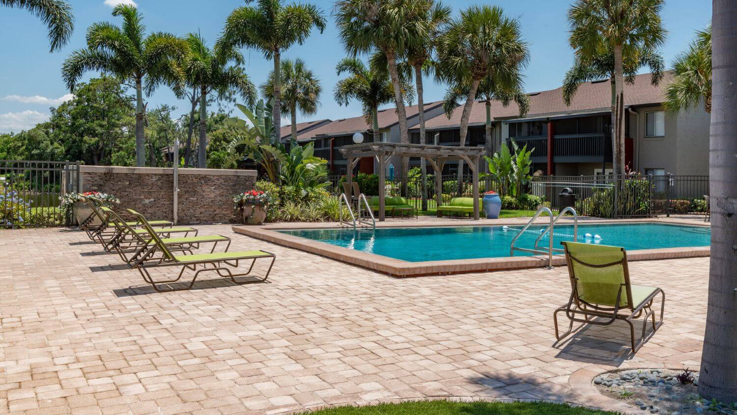 Resort-style swimming pool with veranda