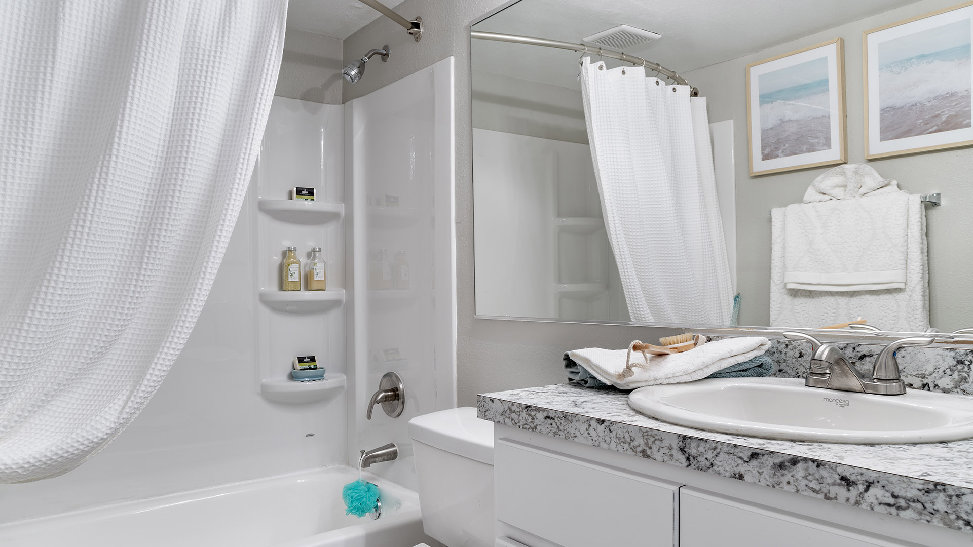 Renovated Luxury bathrooms with granite-style countertops